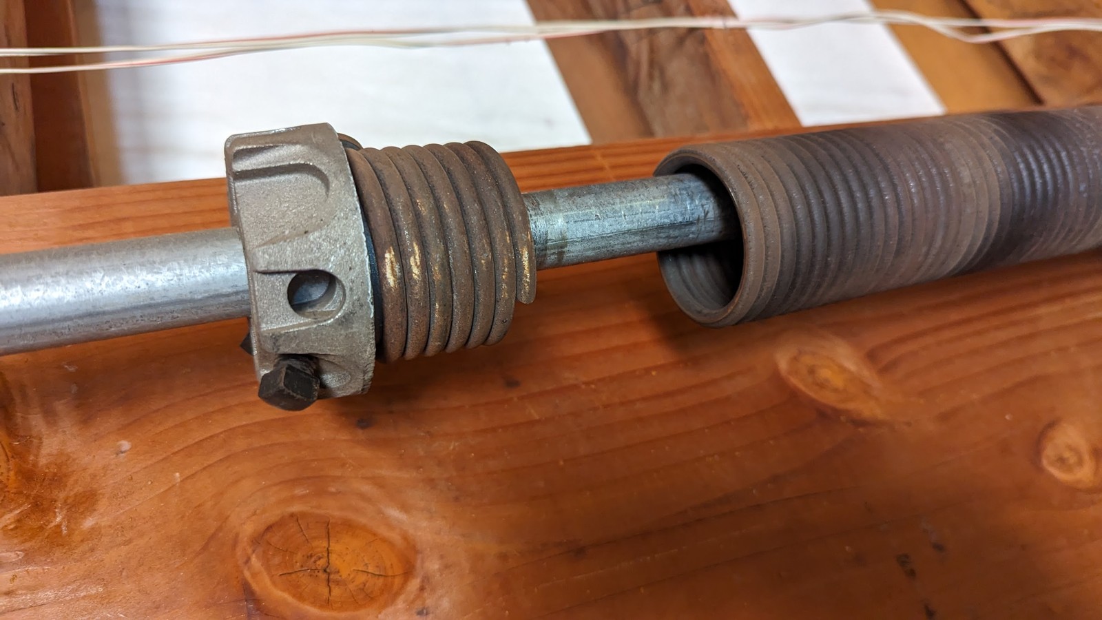 Visible separation in a broken garage door torsion spring