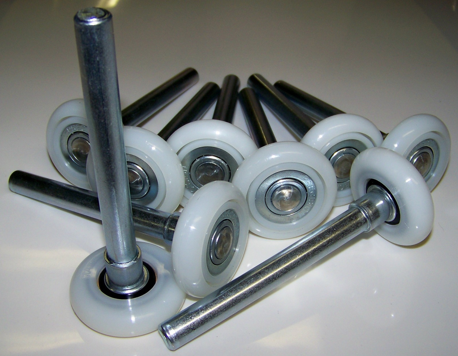 Nylon garage door rollers with steel stems and bearings